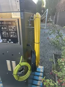 Rear setup showing high-pressure hose reel along with low-pressure and high-pressure chemical lines installed on a Nilfisk 400HS DTE system. Designed for flexible chemical application and improved usability on site.